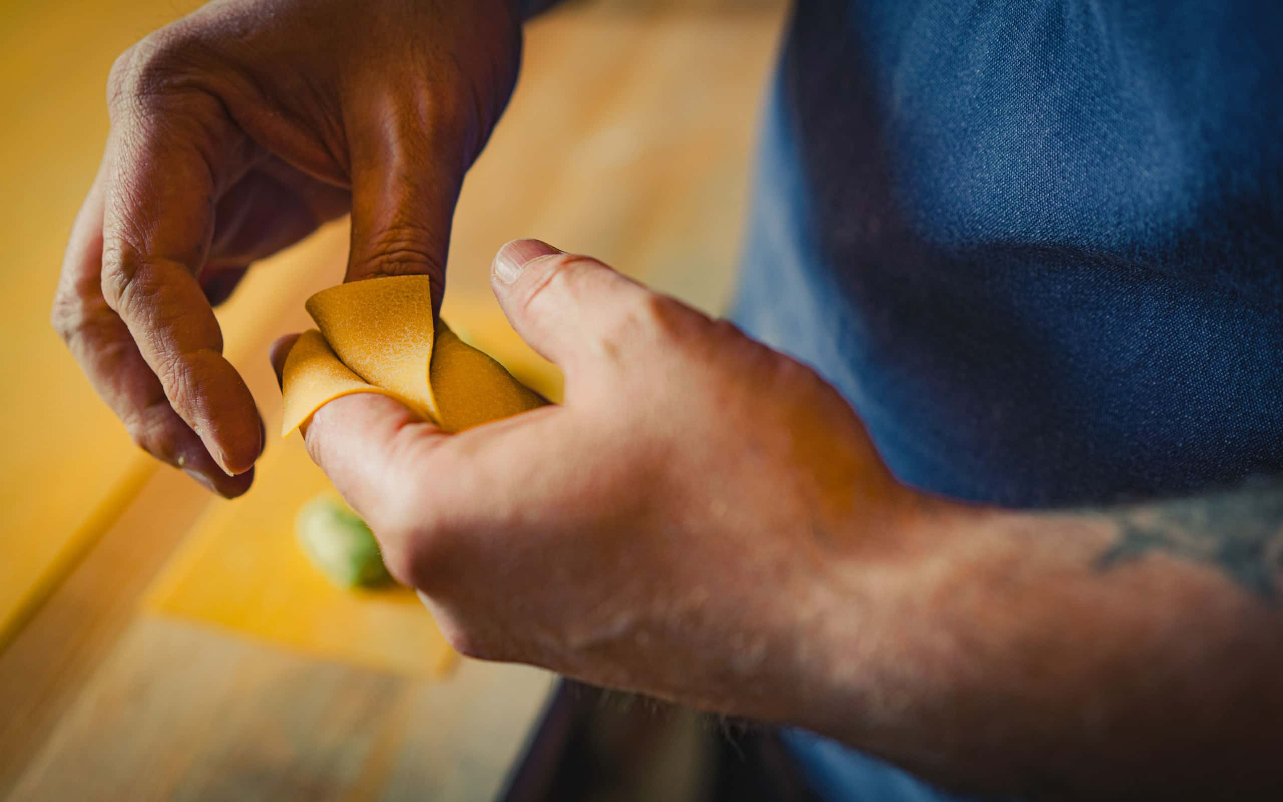 Close-up of Evan Funke creating pasta