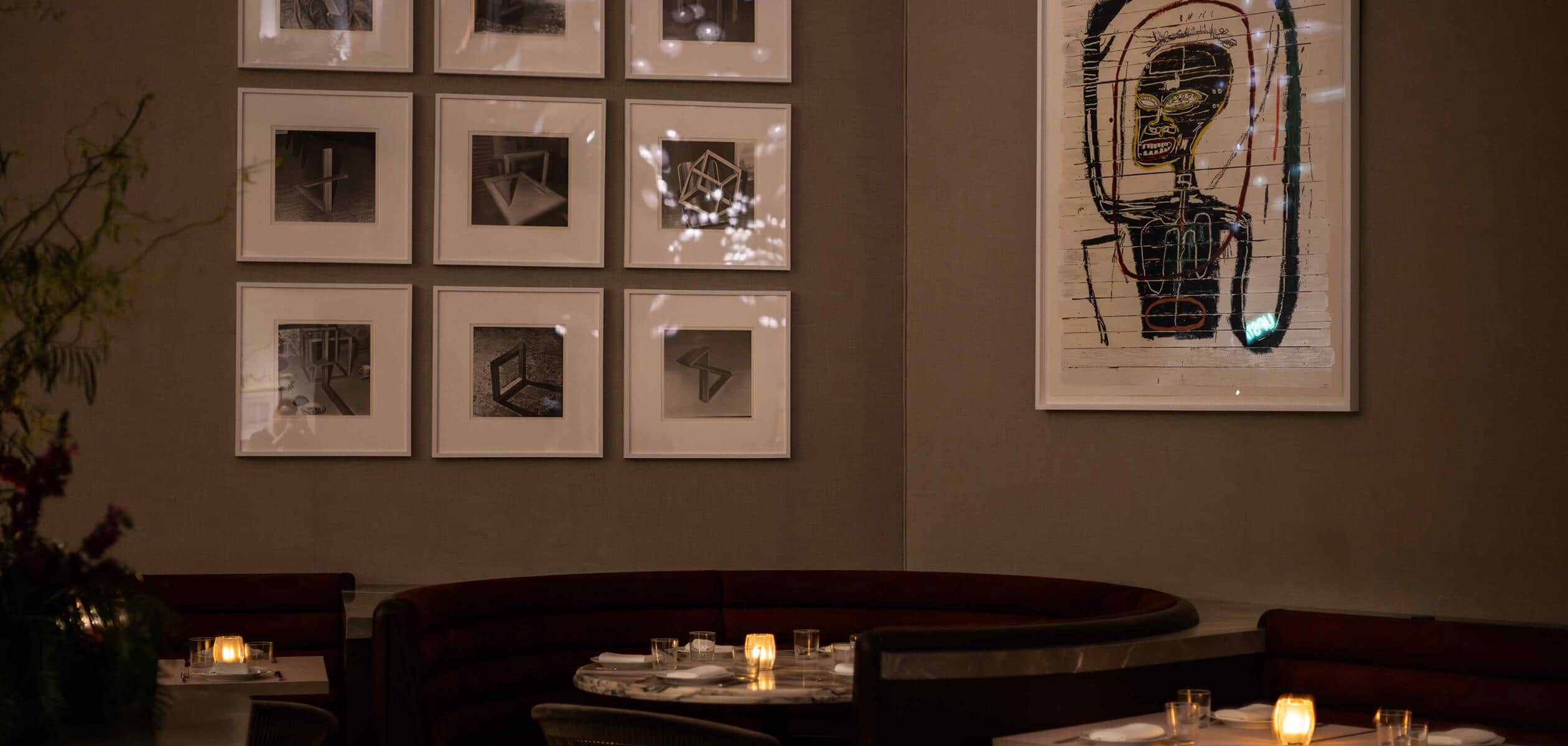 Interior design at Funke showing decorations on the wall and tables below it
